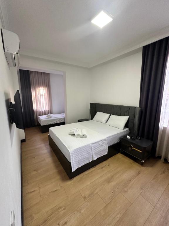 Postel nebo postele na pokoji v ubytování Davidson Boutique Hotel