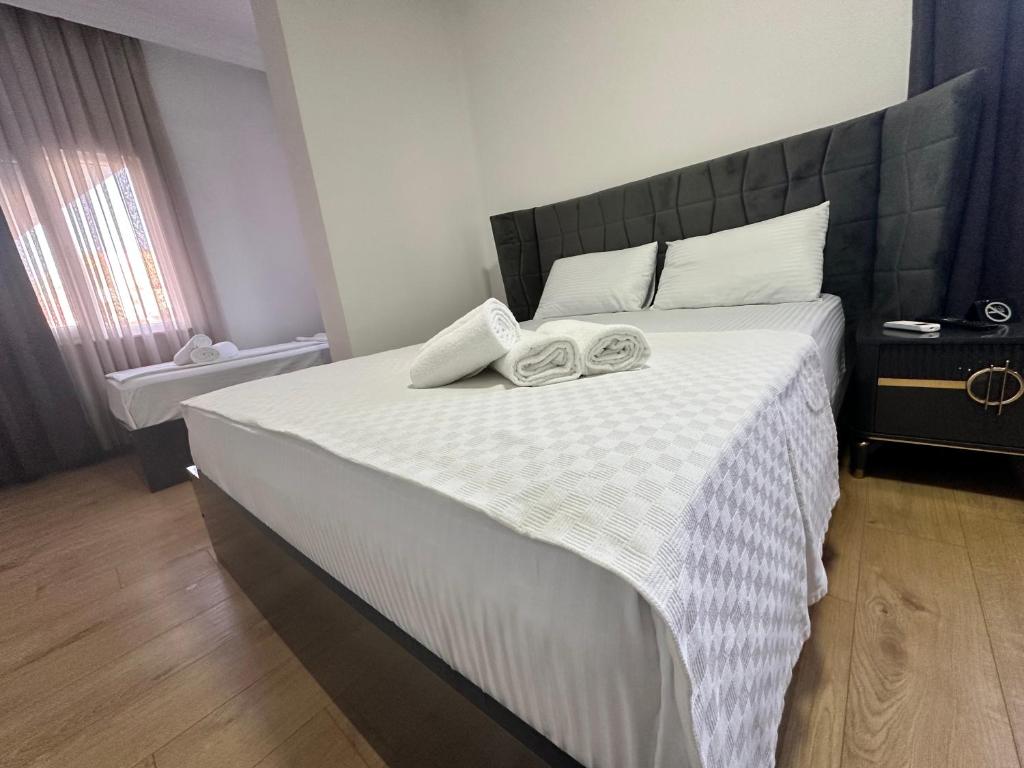 Postel nebo postele na pokoji v ubytování Davidson Boutique Hotel