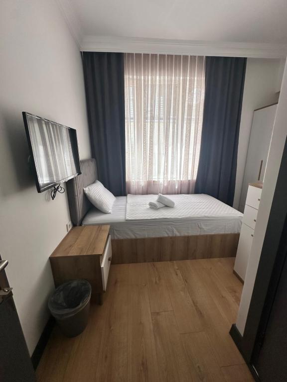 Postel nebo postele na pokoji v ubytování Davidson Boutique Hotel