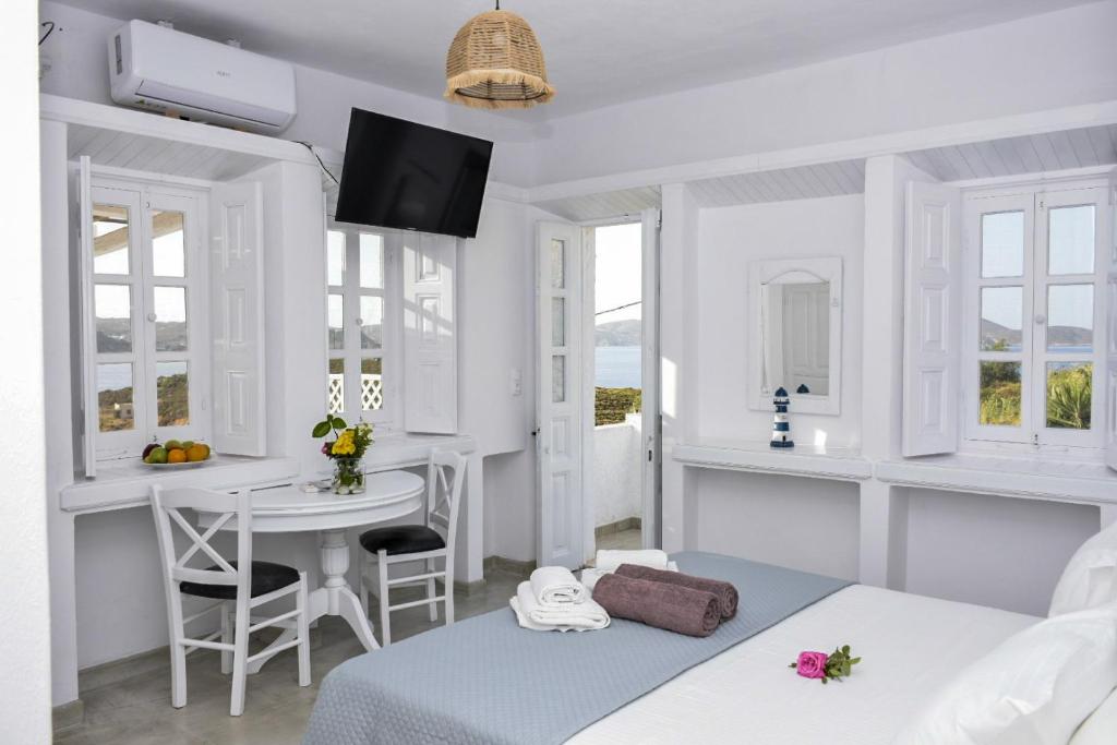 Postel nebo postele na pokoji v ubytování Sapsila Patmos Residences