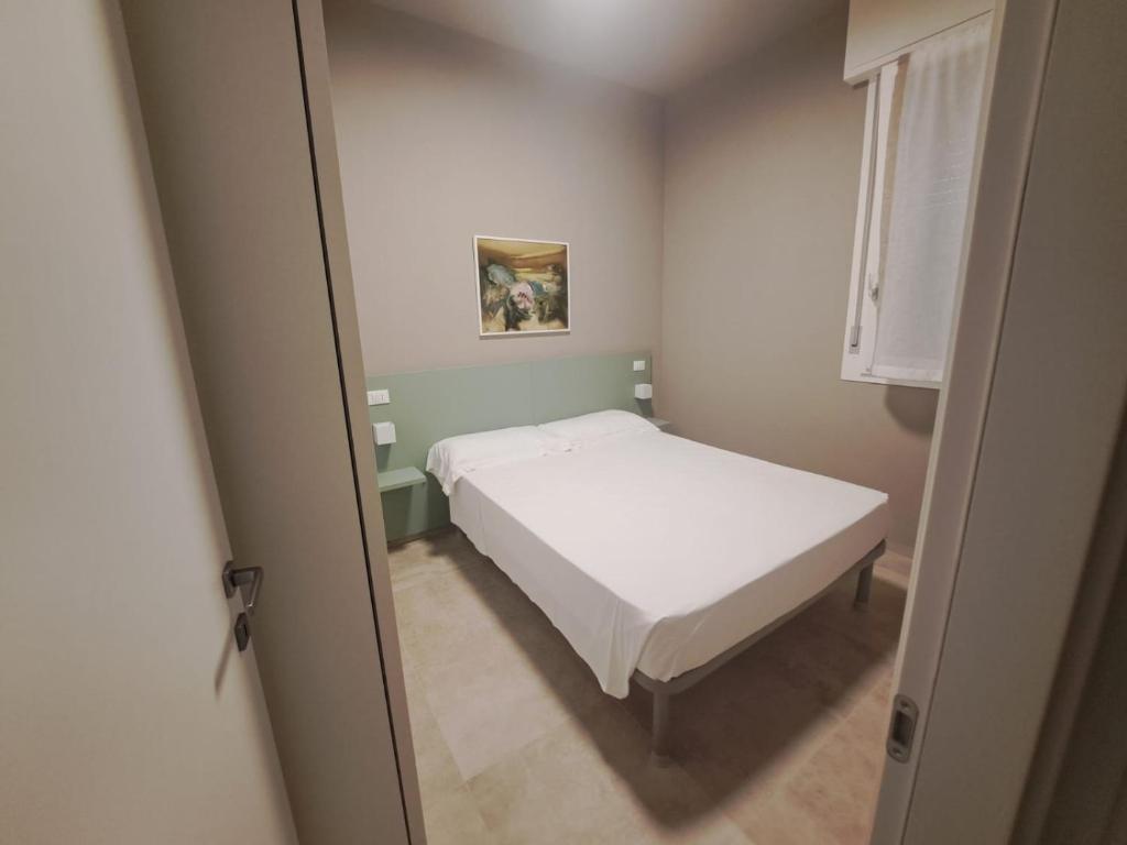 En eller flere senge i et værelse på Villa Taormina