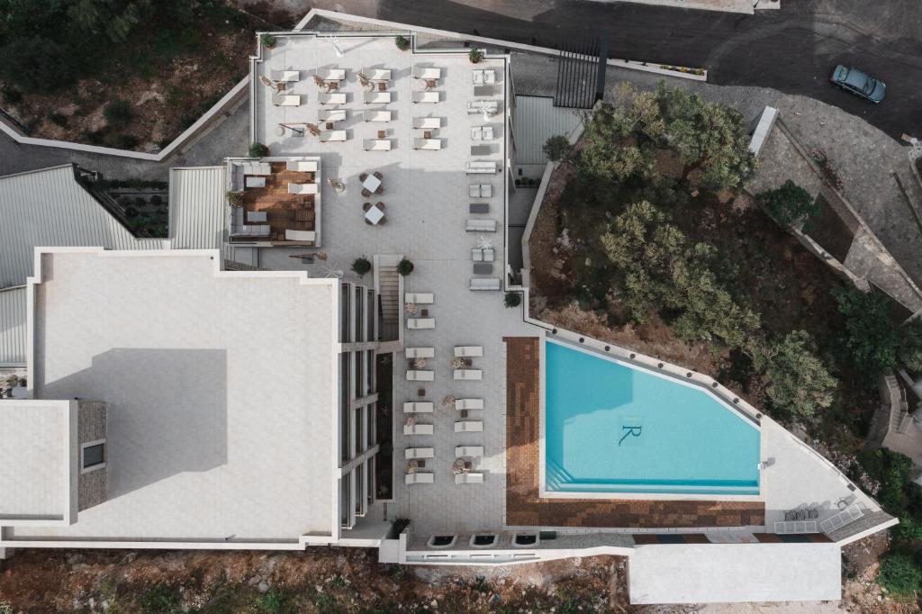 an aerial view of a building with a swimming pool at Regent Resort Budva in Budva