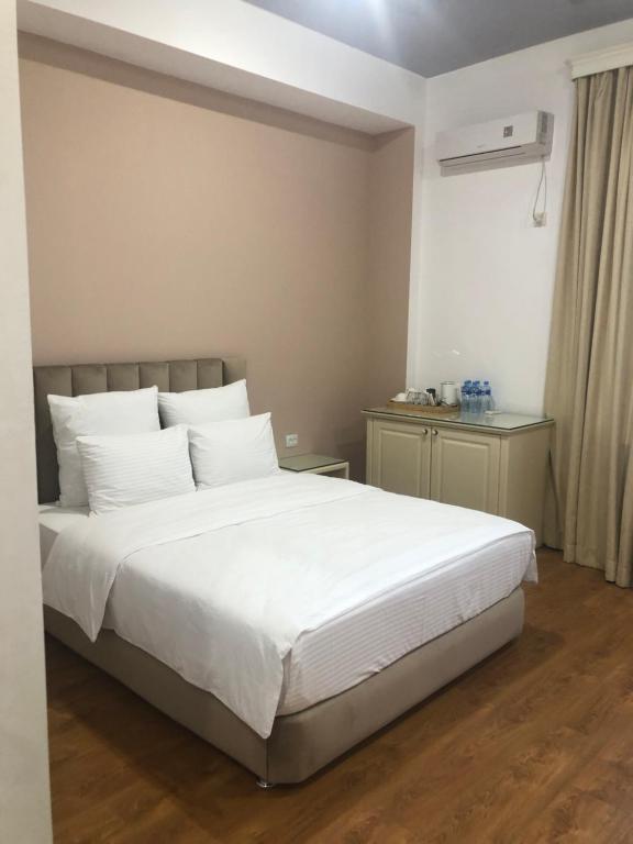 Postel nebo postele na pokoji v ubytování Wald Hotel Lagodekhi
