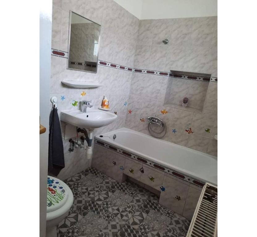 Kúpeľňa v ubytovaní Napfény Apartman