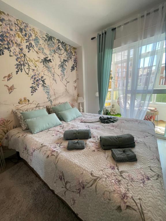 En eller flere senge i et værelse på Apartamento Arte Malaga