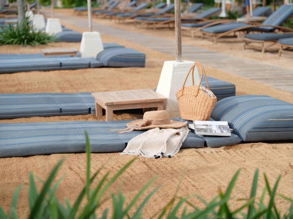 a bunch of blue blankets on the beach at Blu-Zea Resort by Double-Six in Seminyak