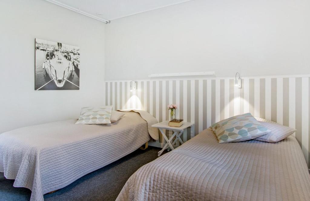 Postel nebo postele na pokoji v ubytování Hotel Skovpavillonen