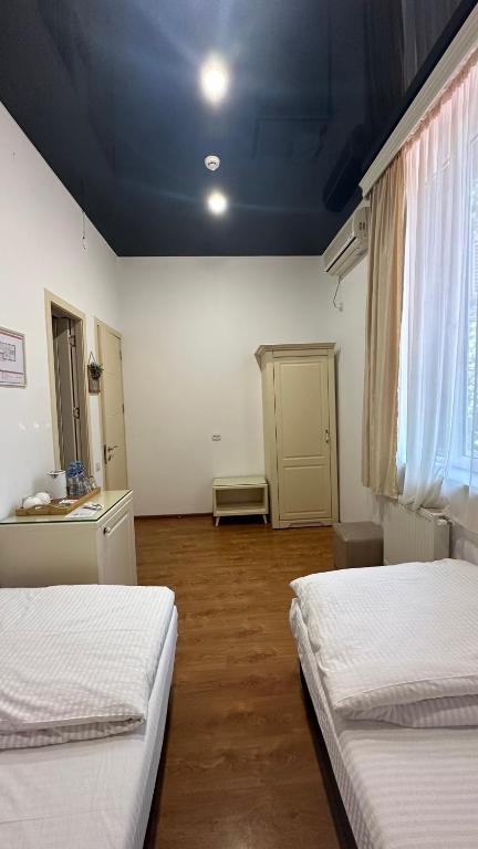 Postel nebo postele na pokoji v ubytování Wald Hotel Lagodekhi