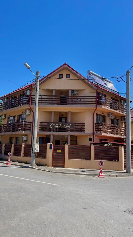 a large building on the side of a street at Casa Cristal in Eforie Nord