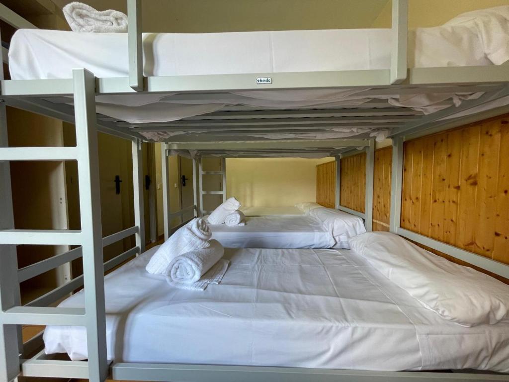 Postel nebo postele na pokoji v ubytování Hotel Taüll