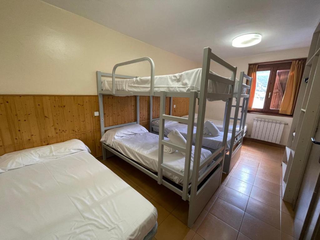 Postel nebo postele na pokoji v ubytování Hotel Taüll