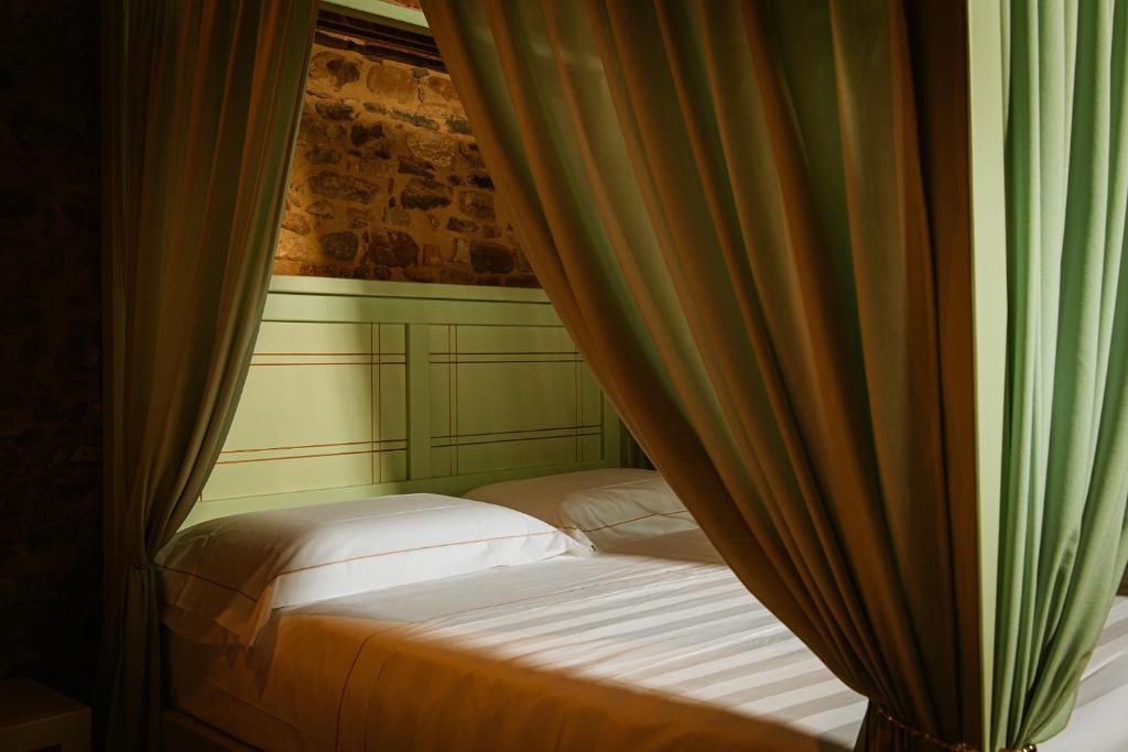 Voodi või voodid majutusasutuse Agriturismo Molinella toas