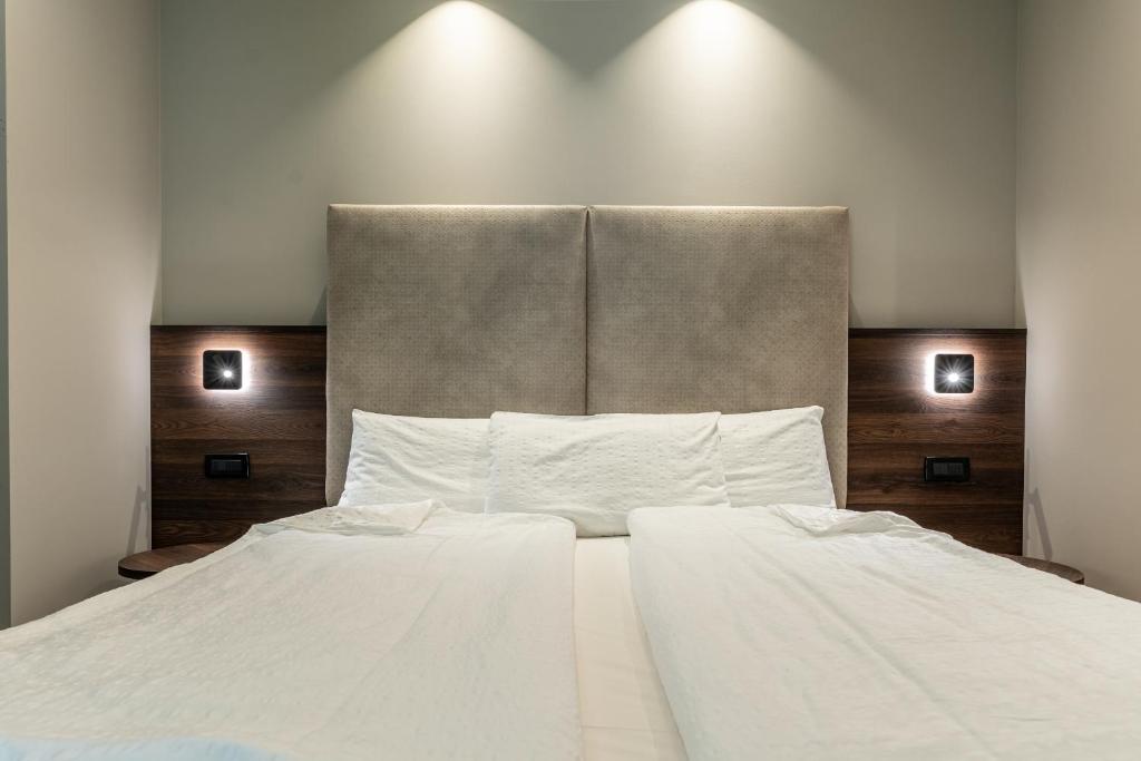 Postel nebo postele na pokoji v ubytování Hotel Ariston