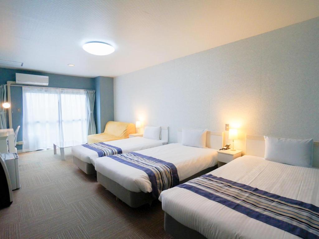 Hotel Caretta - Dreibettzimmer