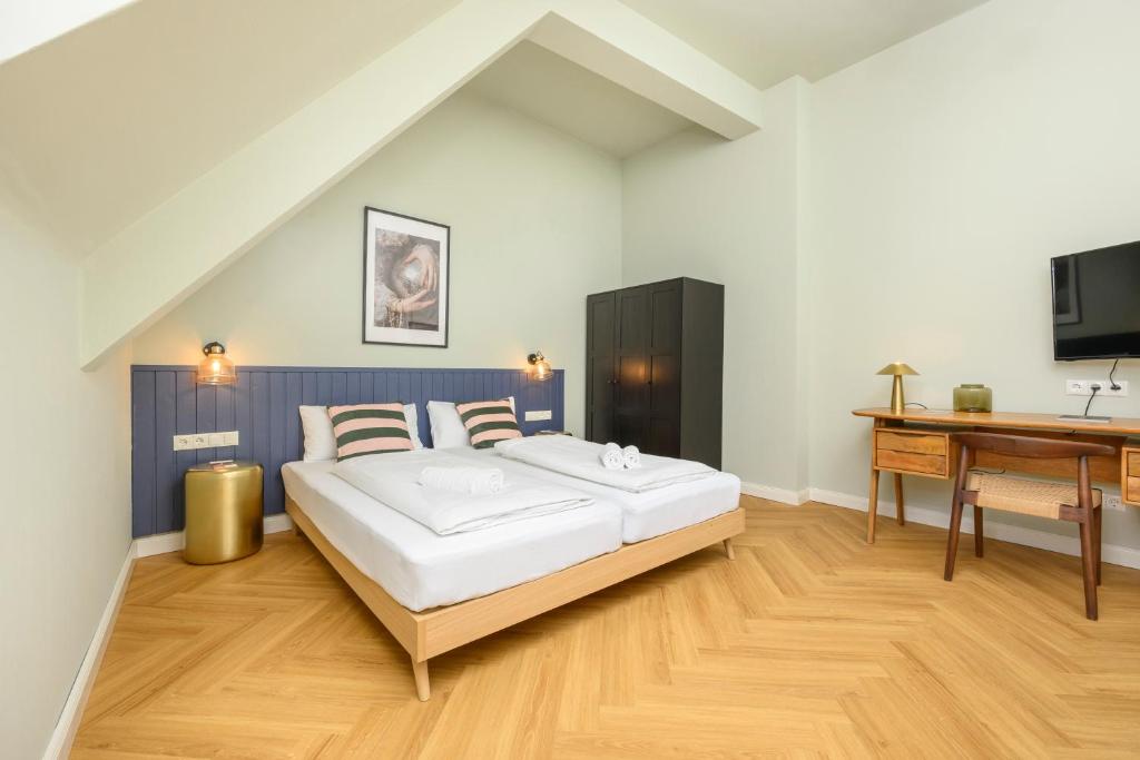 Posteľ alebo postele v izbe v ubytovaní Palais Palffy Suits