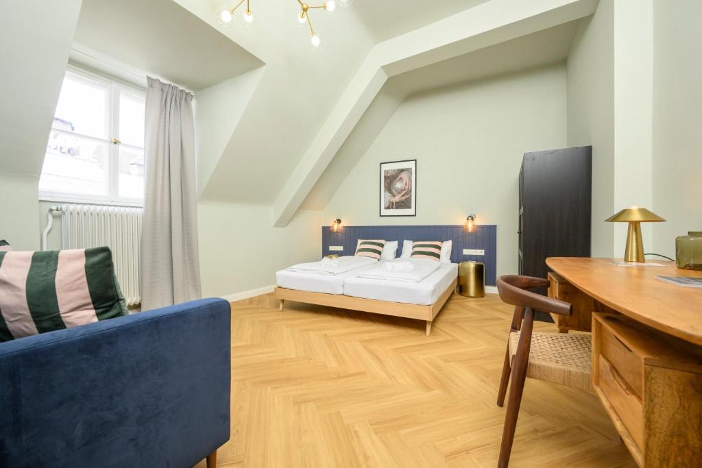 Posteľ alebo postele v izbe v ubytovaní Palais Palffy Suits