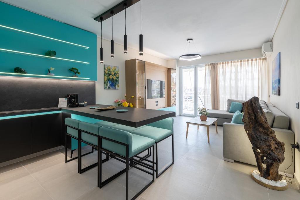 a kitchen and living room with a table and chairs at The View - Tiffany Luxury 2 BR, Free Parking, Central in Sarandë