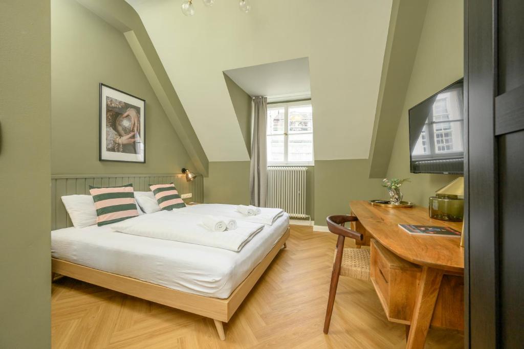Posteľ alebo postele v izbe v ubytovaní Palais Palffy Suits