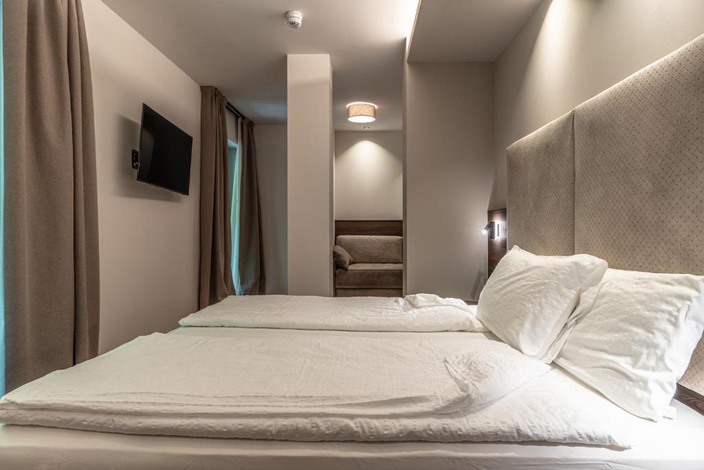 Postel nebo postele na pokoji v ubytování Hotel Ariston