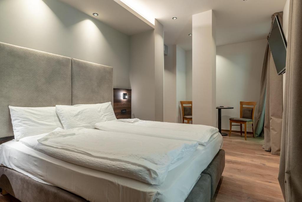 Postel nebo postele na pokoji v ubytování Hotel Ariston