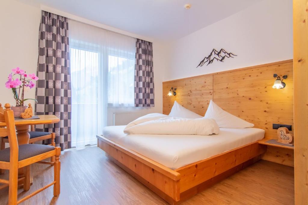 Postel nebo postele na pokoji v ubytování Pension am Rain