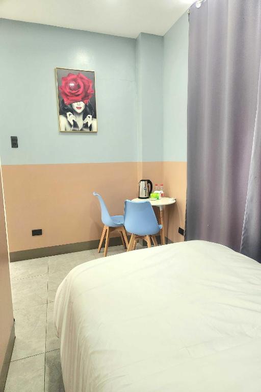 Postel nebo postele na pokoji v ubytování Qingqing Hotel Pasay Manila near MOA