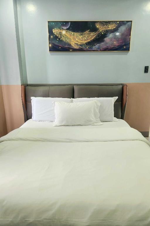 Postel nebo postele na pokoji v ubytování Qingqing Hotel Pasay Manila near MOA