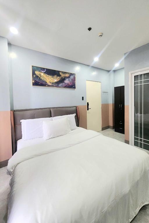 Postel nebo postele na pokoji v ubytování Qingqing Hotel Pasay Manila near MOA
