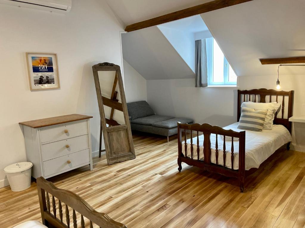 Posteľ alebo postele v izbe v ubytovaní La Ferme Delaunay
