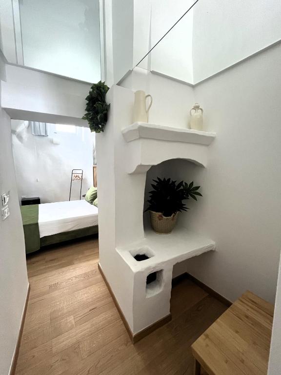 Postel nebo postele na pokoji v ubytování La Bella Ostuni Suites