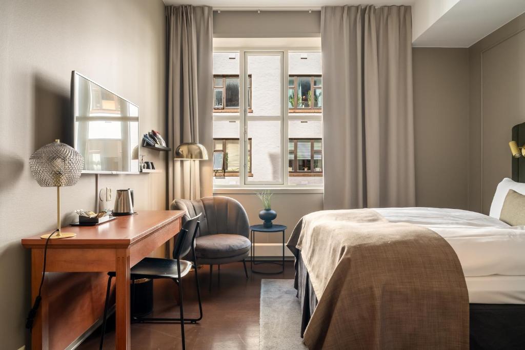 Postel nebo postele na pokoji v ubytování Home Hotel Bryggen