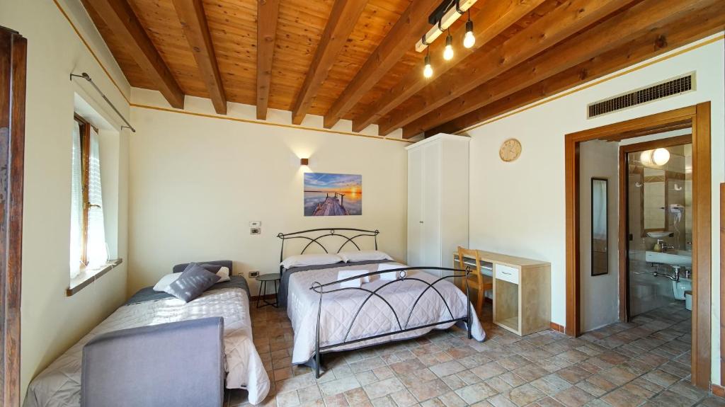 Postel nebo postele na pokoji v ubytování B&B Relax Rooms - Peschiera del Garda