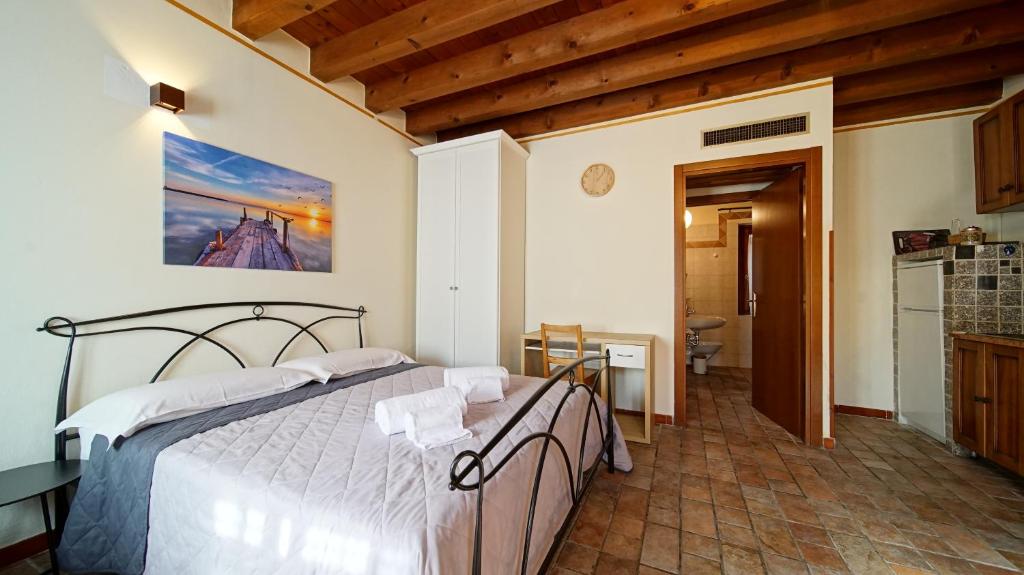 Postel nebo postele na pokoji v ubytování B&B Relax Rooms - Peschiera del Garda