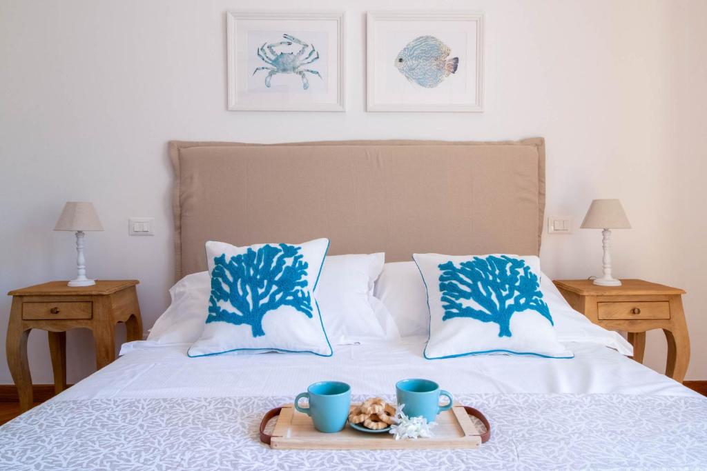 Postel nebo postele na pokoji v ubytování Ermes by PortofinoHomes