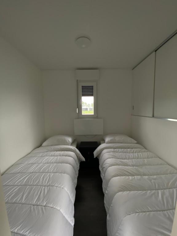 Postel nebo postele na pokoji v ubytování Vakantiepark Lemmer