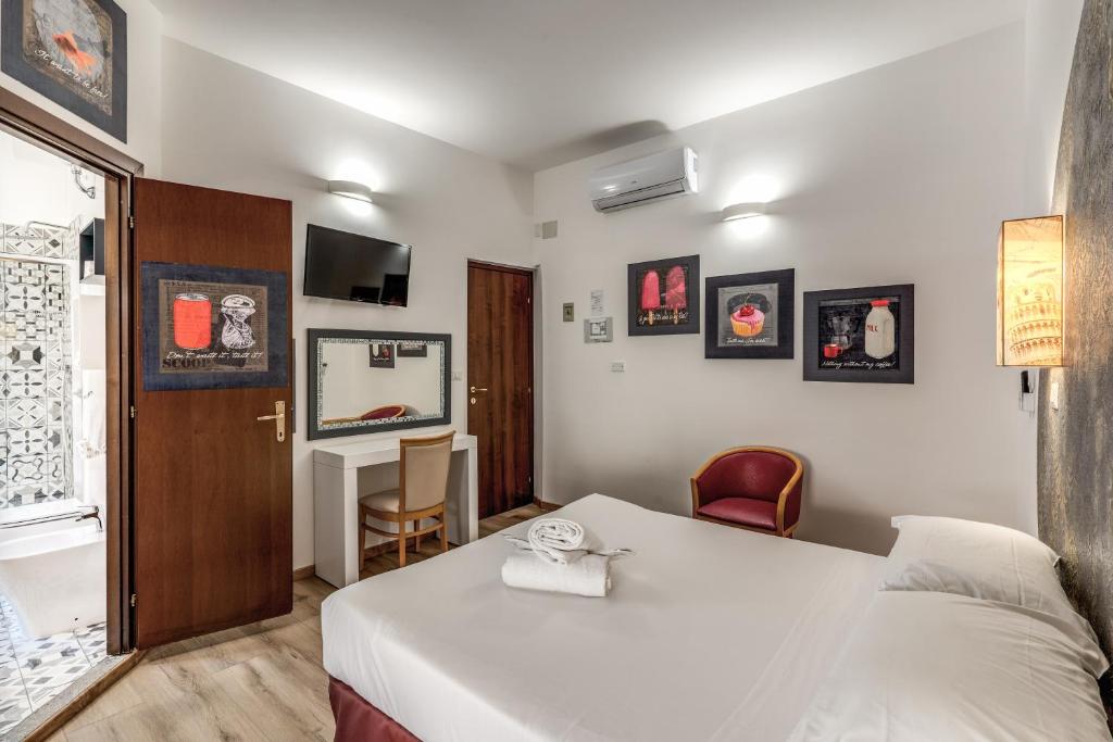 Postel nebo postele na pokoji v ubytování Hotel Santa Prassede