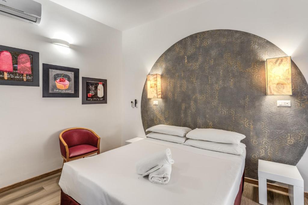 Postel nebo postele na pokoji v ubytování Hotel Santa Prassede