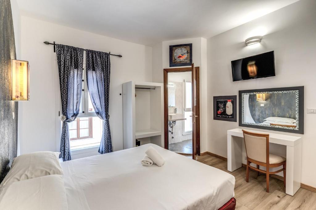 Postel nebo postele na pokoji v ubytování Hotel Santa Prassede