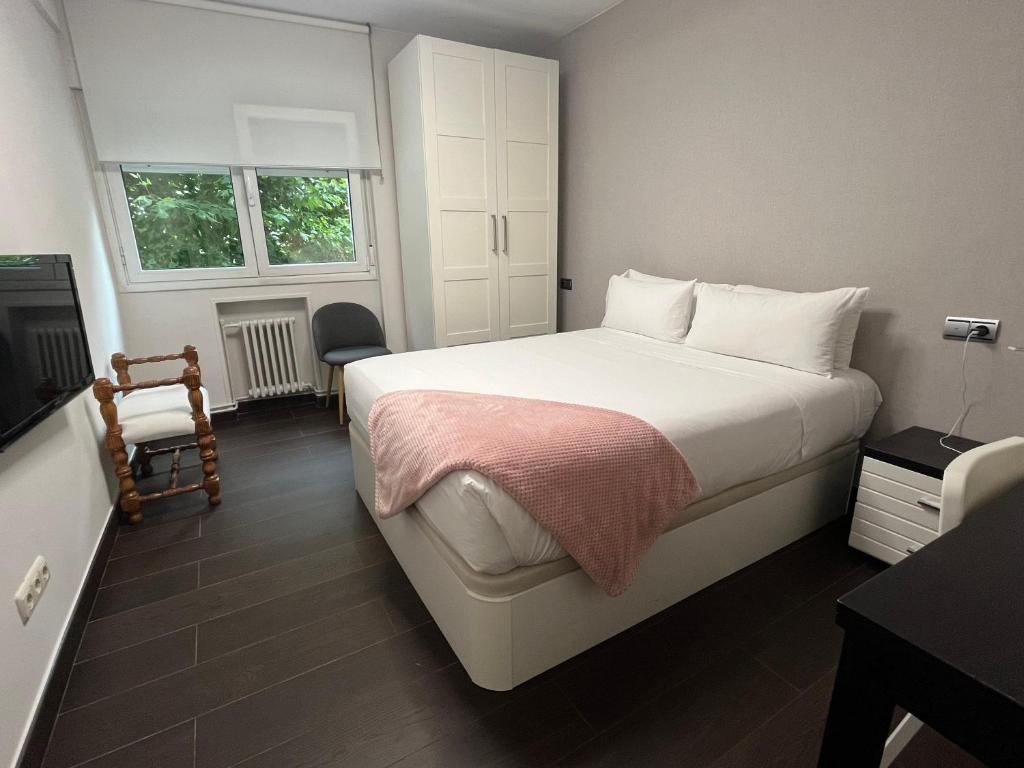 Posteľ alebo postele v izbe v ubytovaní Apartamento Anoeta