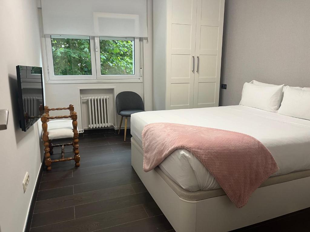 Posteľ alebo postele v izbe v ubytovaní Apartamento Anoeta