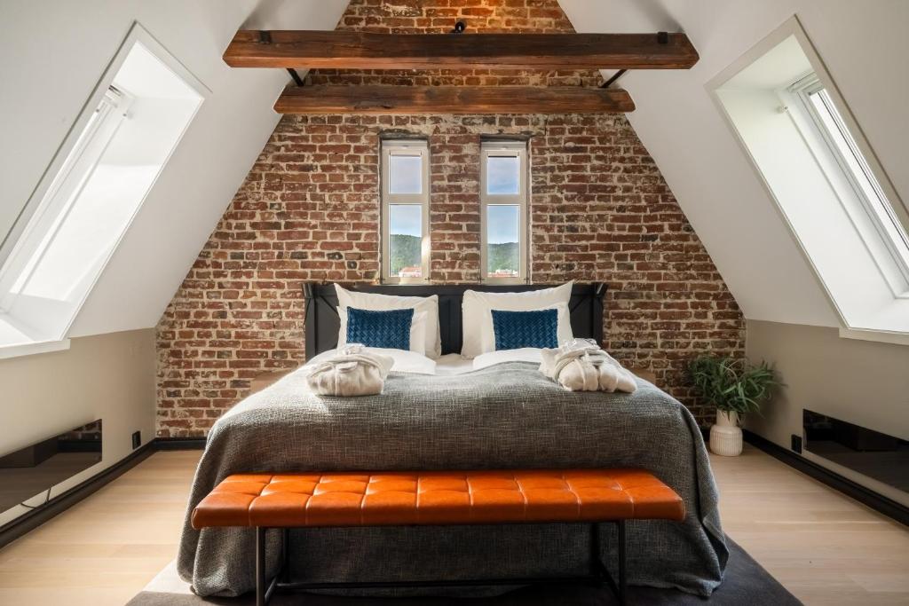 Postel nebo postele na pokoji v ubytování Home Hotel Bryggen