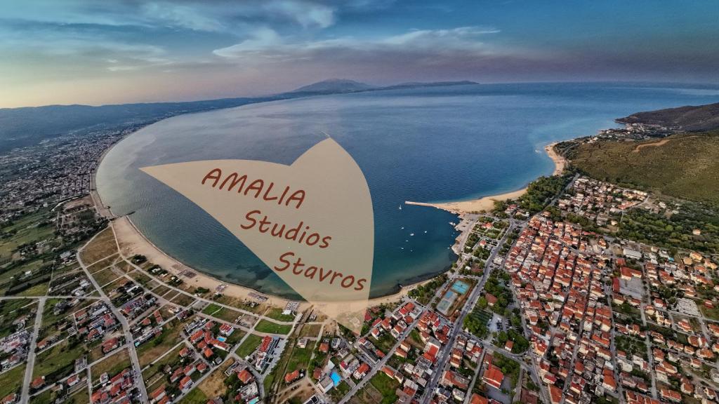an aerial view of a city and the ocean at Amalia in Stavros