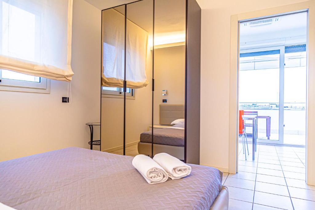 Postel nebo postele na pokoji v ubytování Hotel Avana Fronte Mare