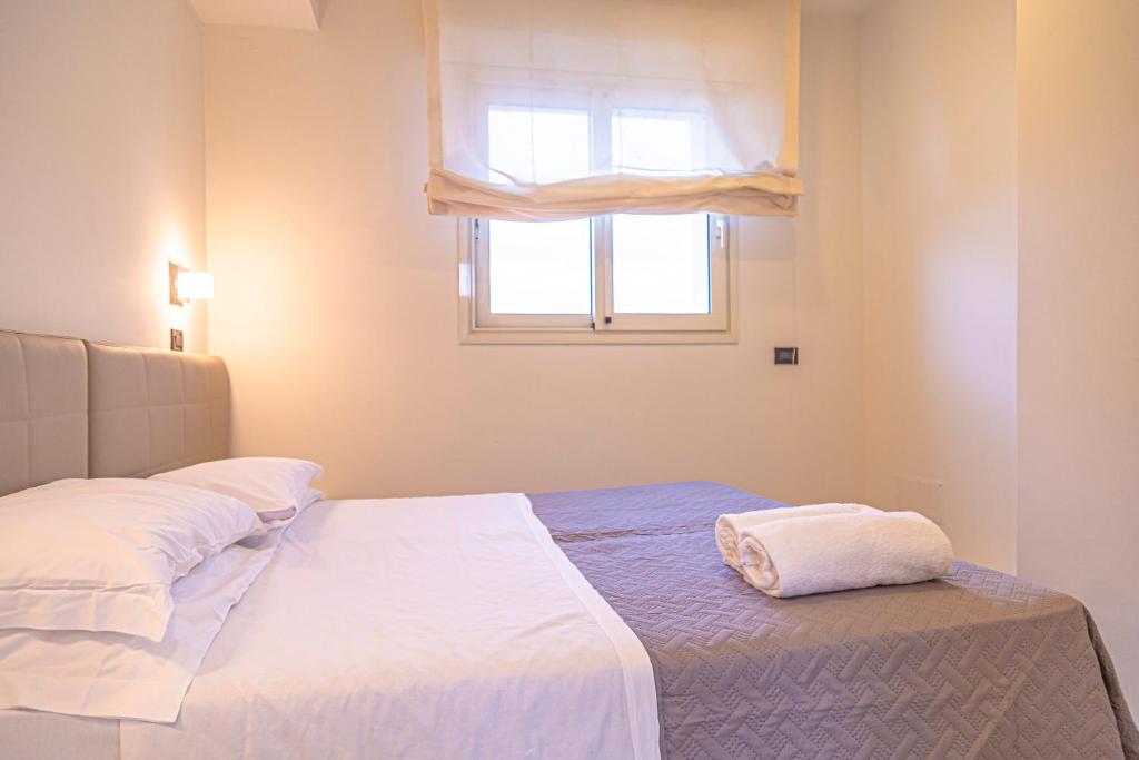 Postel nebo postele na pokoji v ubytování Hotel Avana Fronte Mare