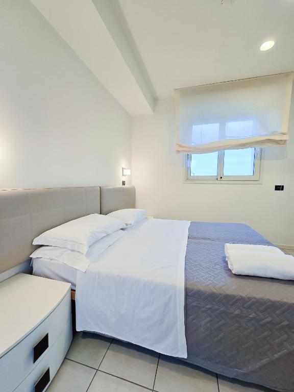 Postel nebo postele na pokoji v ubytování Hotel Avana Fronte Mare