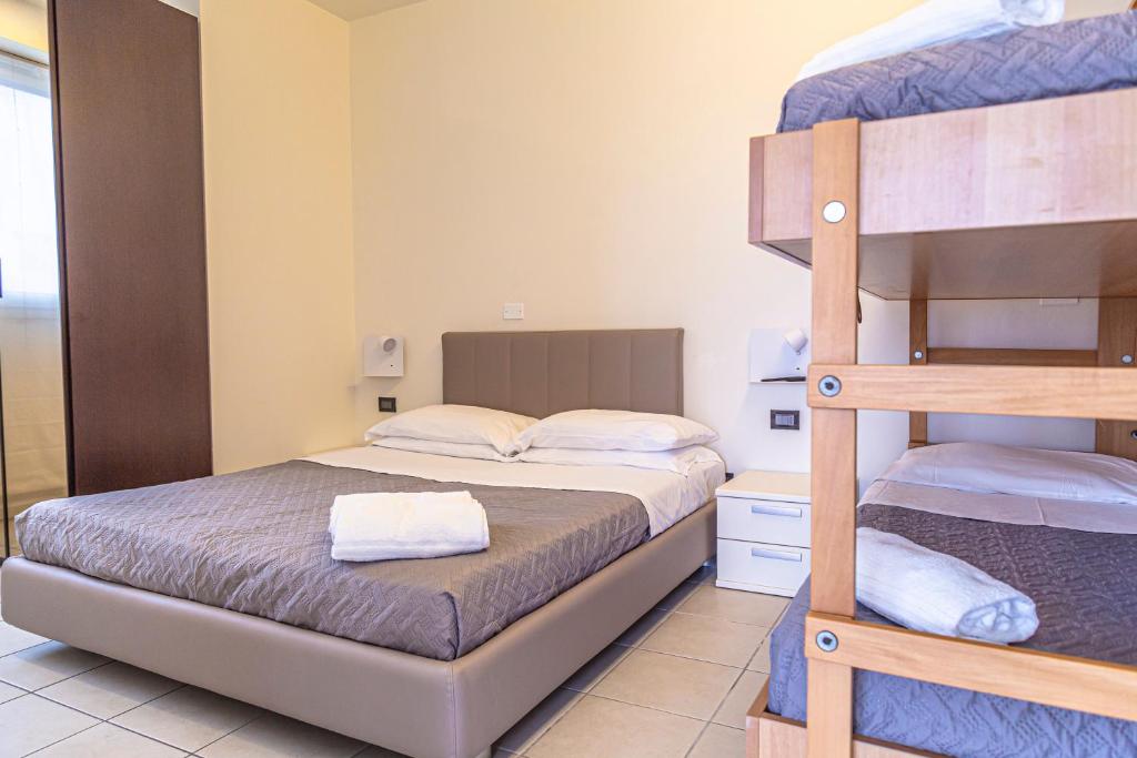 Postel nebo postele na pokoji v ubytování Hotel Avana Fronte Mare