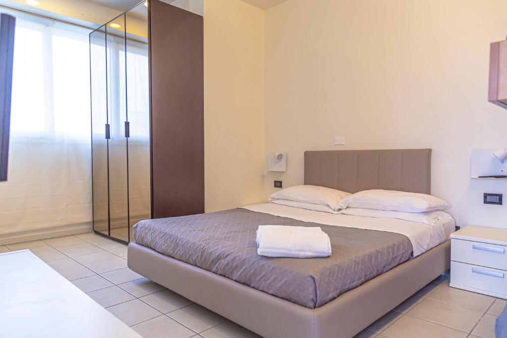 Postel nebo postele na pokoji v ubytování Hotel Avana Fronte Mare