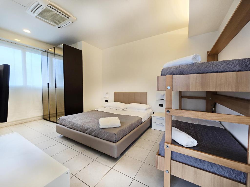 Postel nebo postele na pokoji v ubytování Hotel Avana Fronte Mare