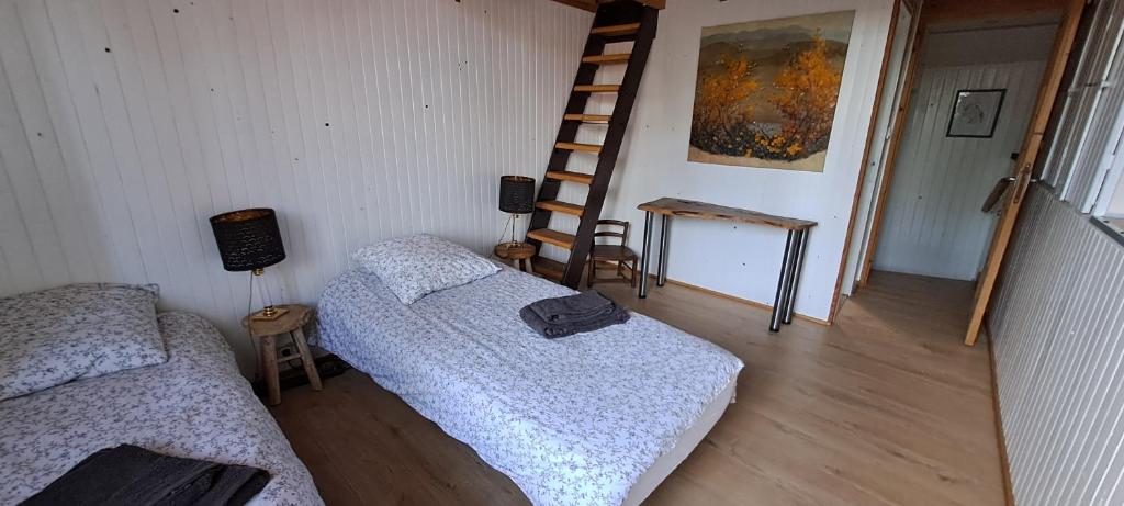 Posteľ alebo postele v izbe v ubytovaní Gite Aux Anciennes Ecuries