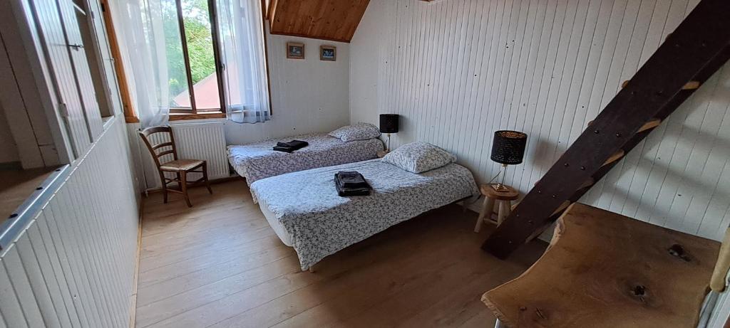 Posteľ alebo postele v izbe v ubytovaní Gite Aux Anciennes Ecuries